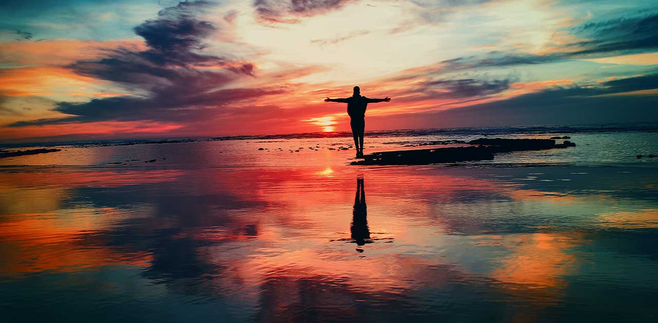 A person enjoying the morning sunrise