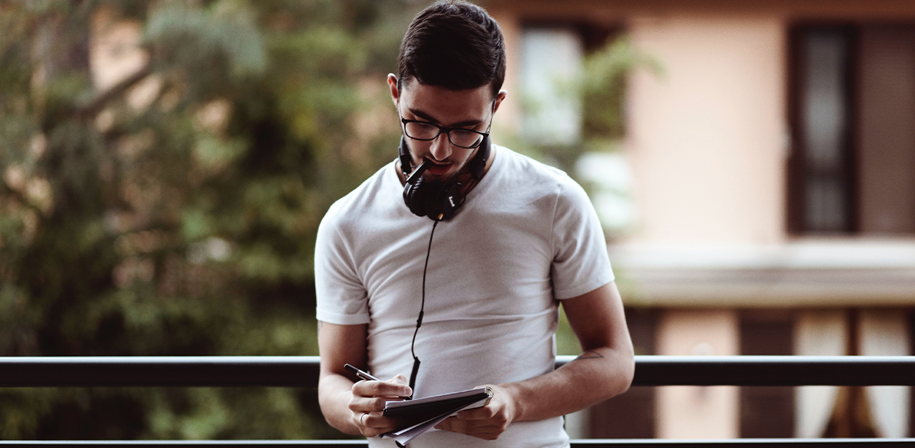 Man writing in notebook