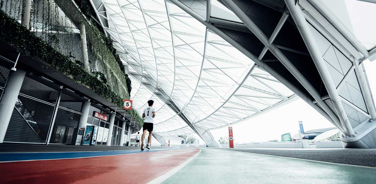 Person running on an indoor running track