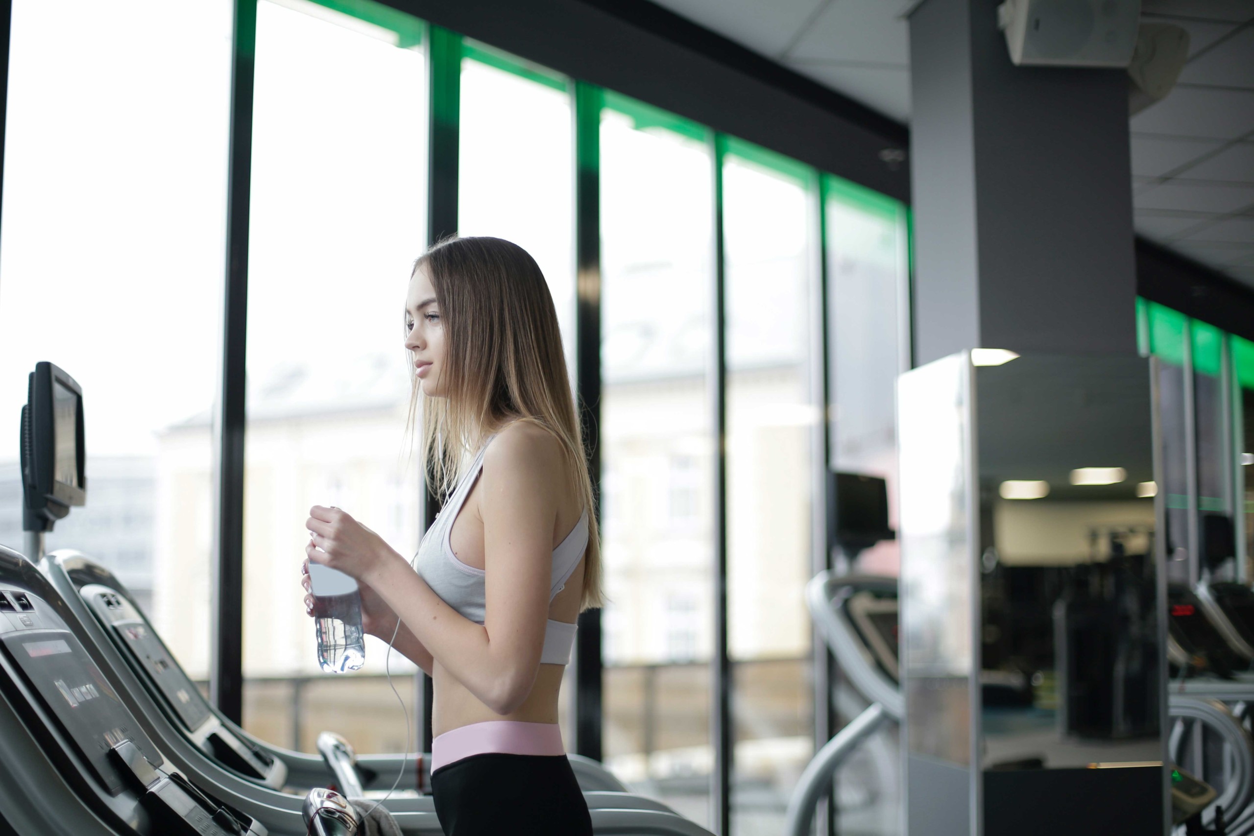 Woman standing on a treadmill