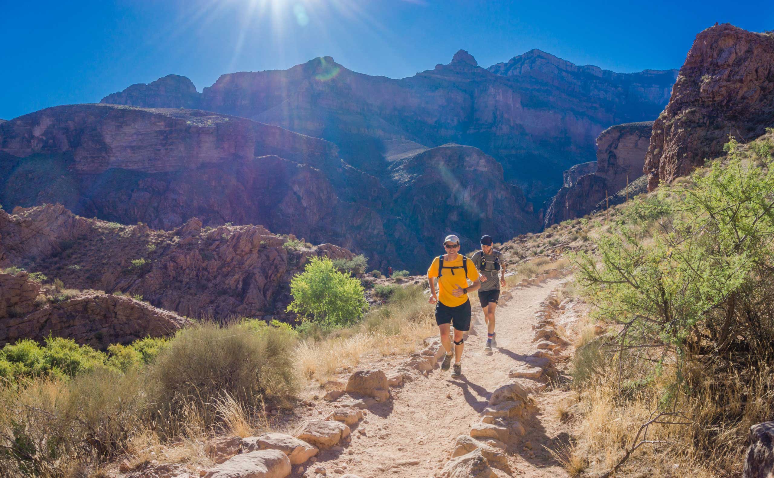 Two men running on the trails