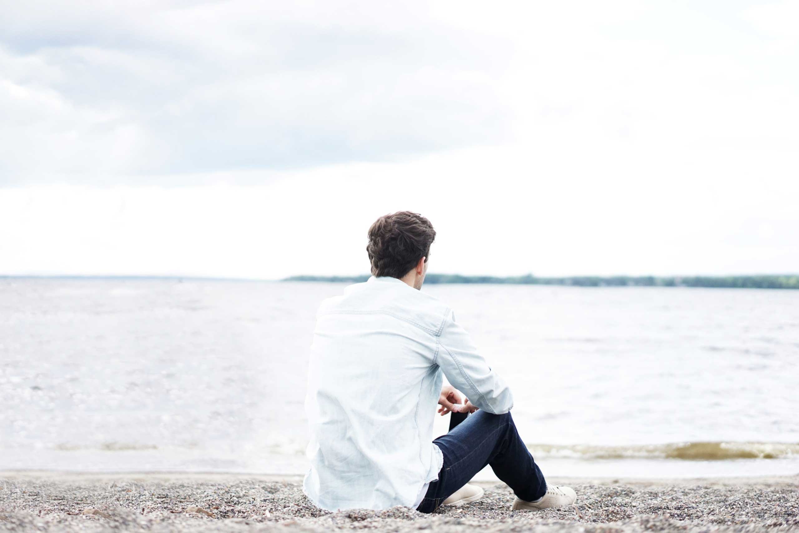 Man looking out toward the sea