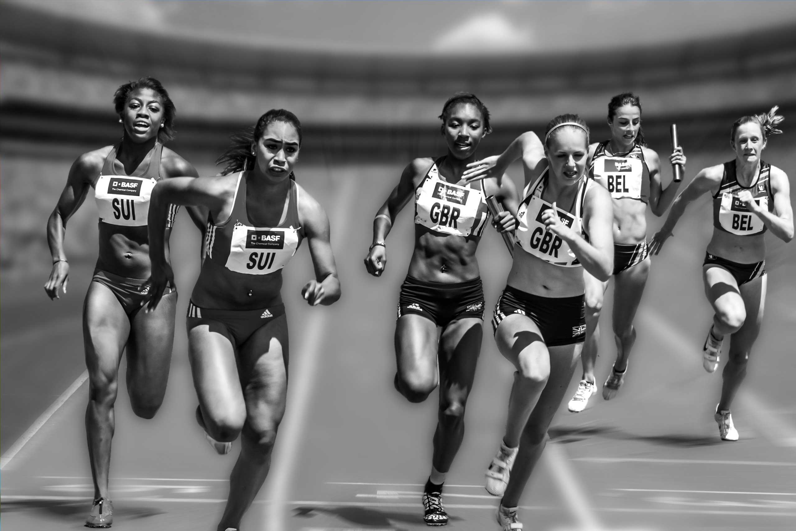 Group of women running on a race track