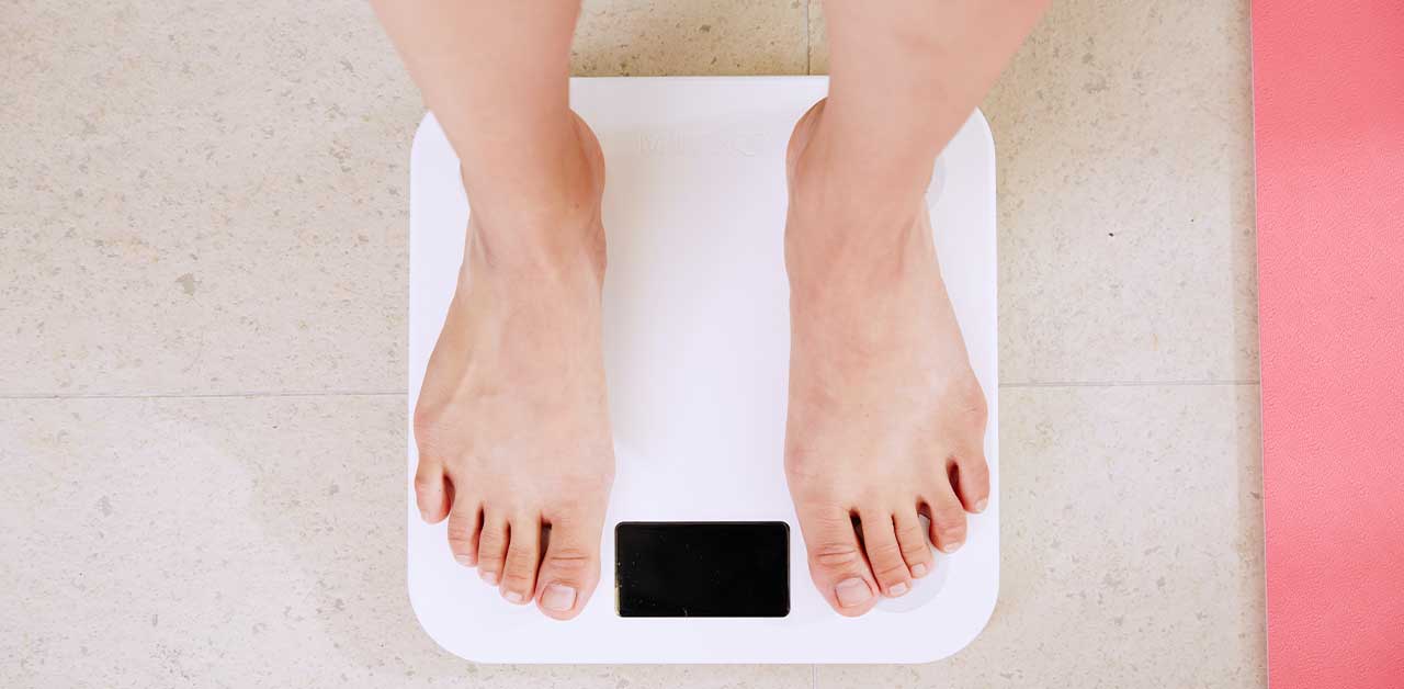 Person standing on scales 