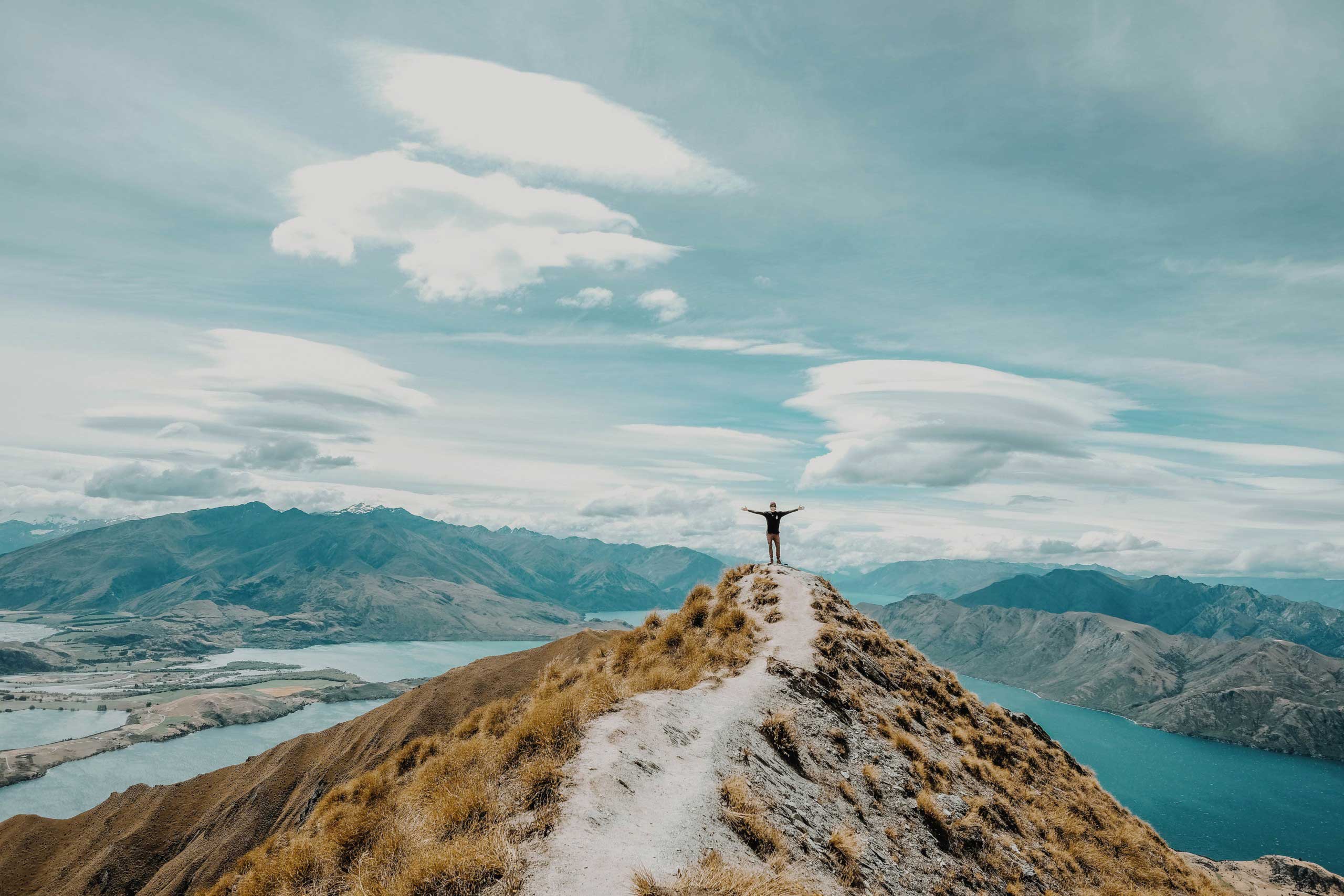 Person stood on the top of a fell 