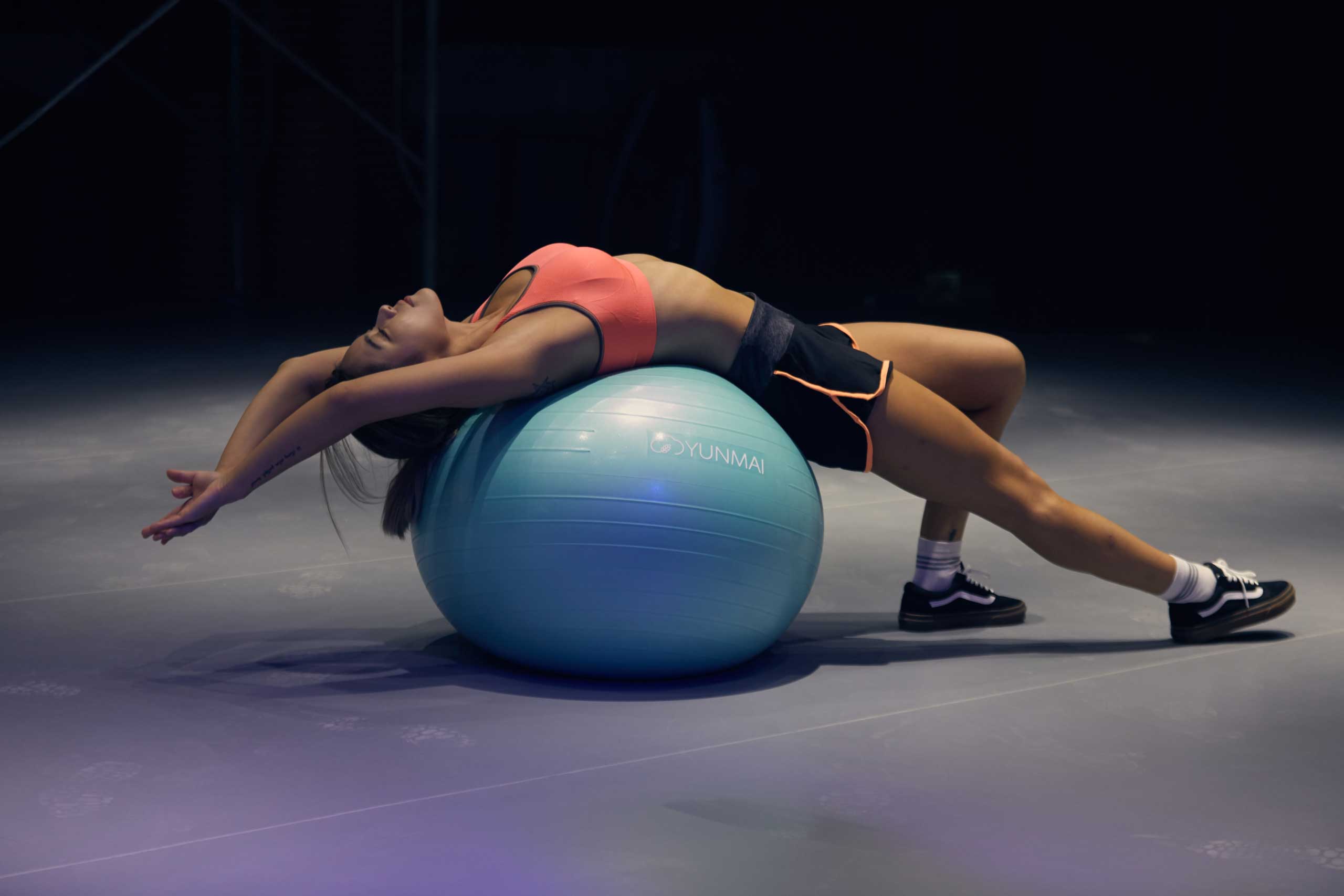 Woman stretching on exercise ball 