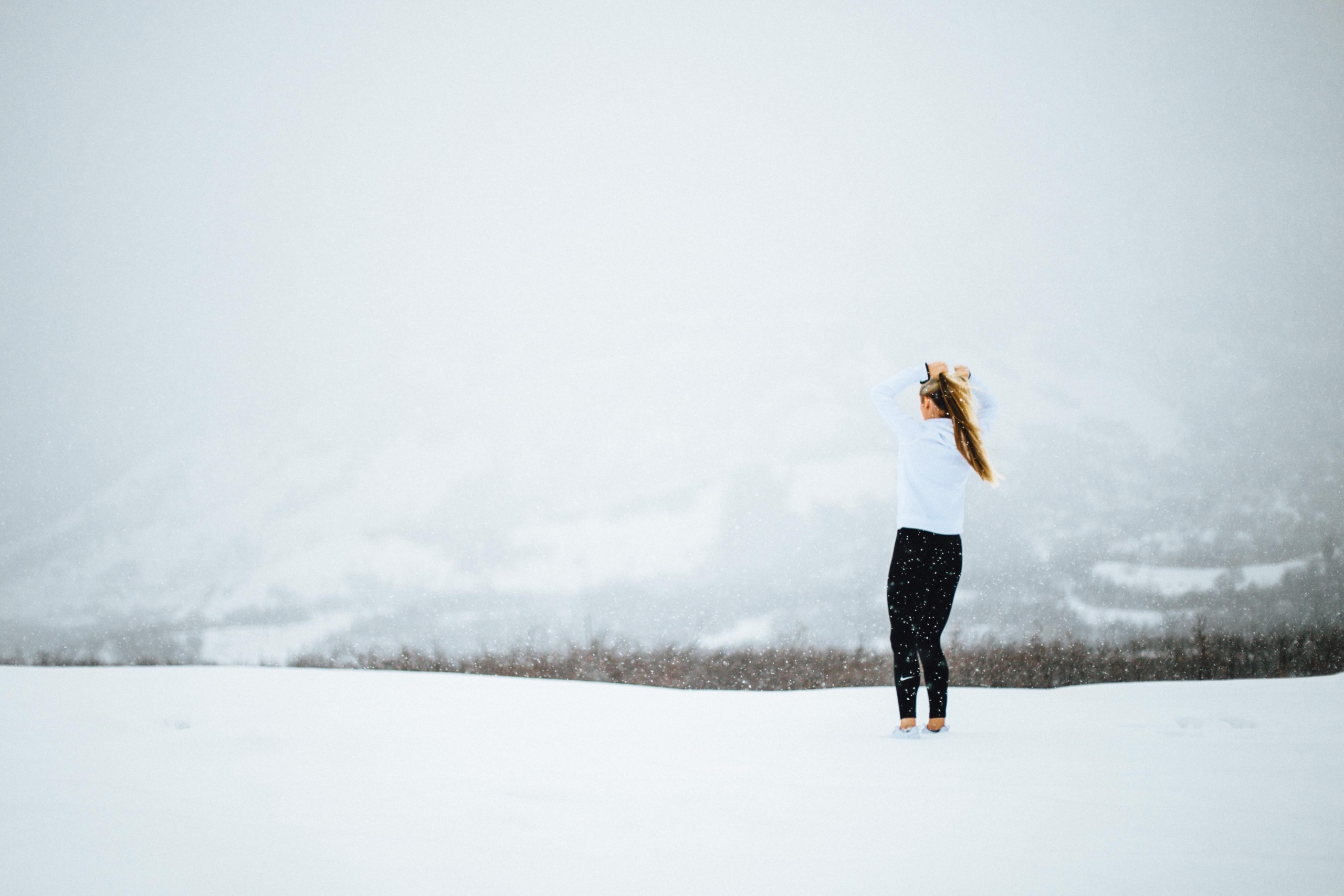 Image of a woman running during winter