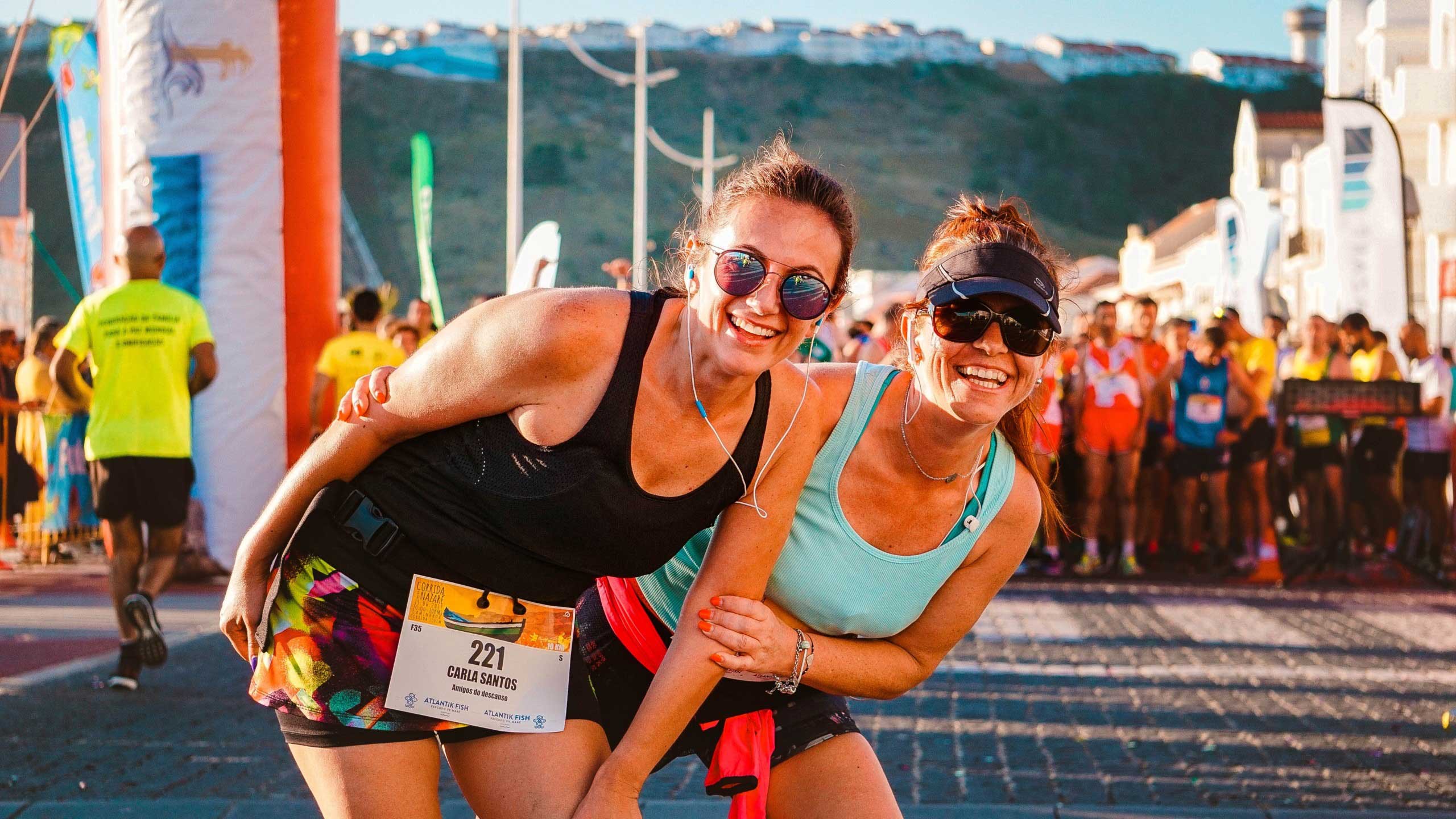 Two women at the finish line of a race