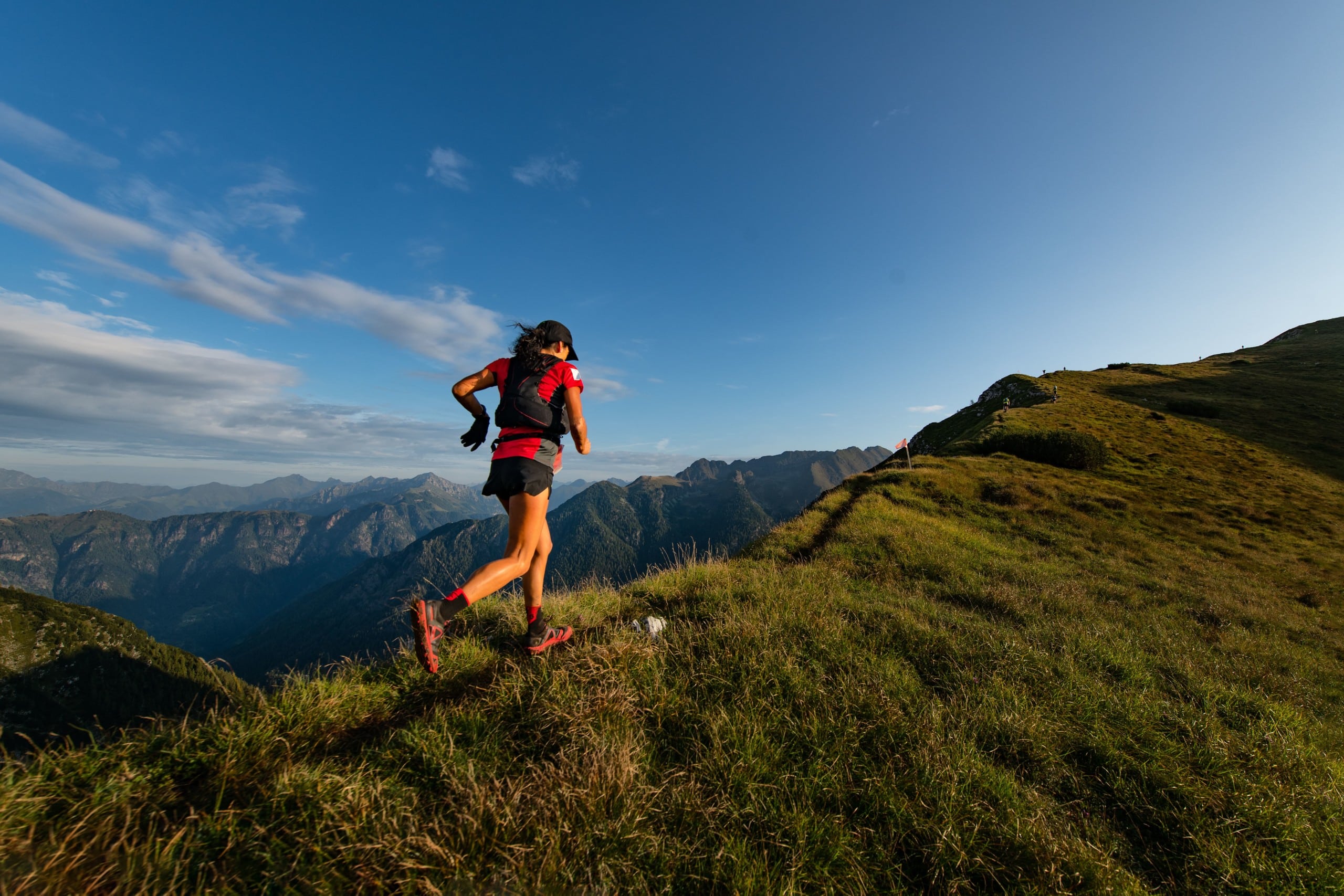 trail runner running in the mountains