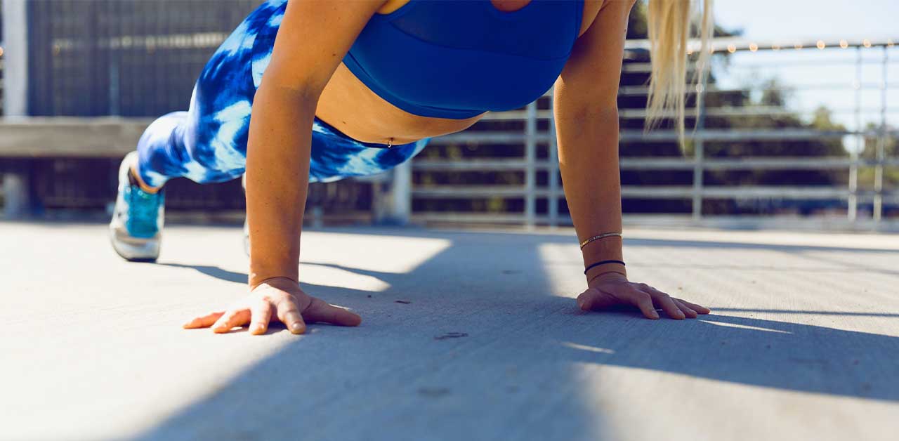 Woman doing pushups (strength training)