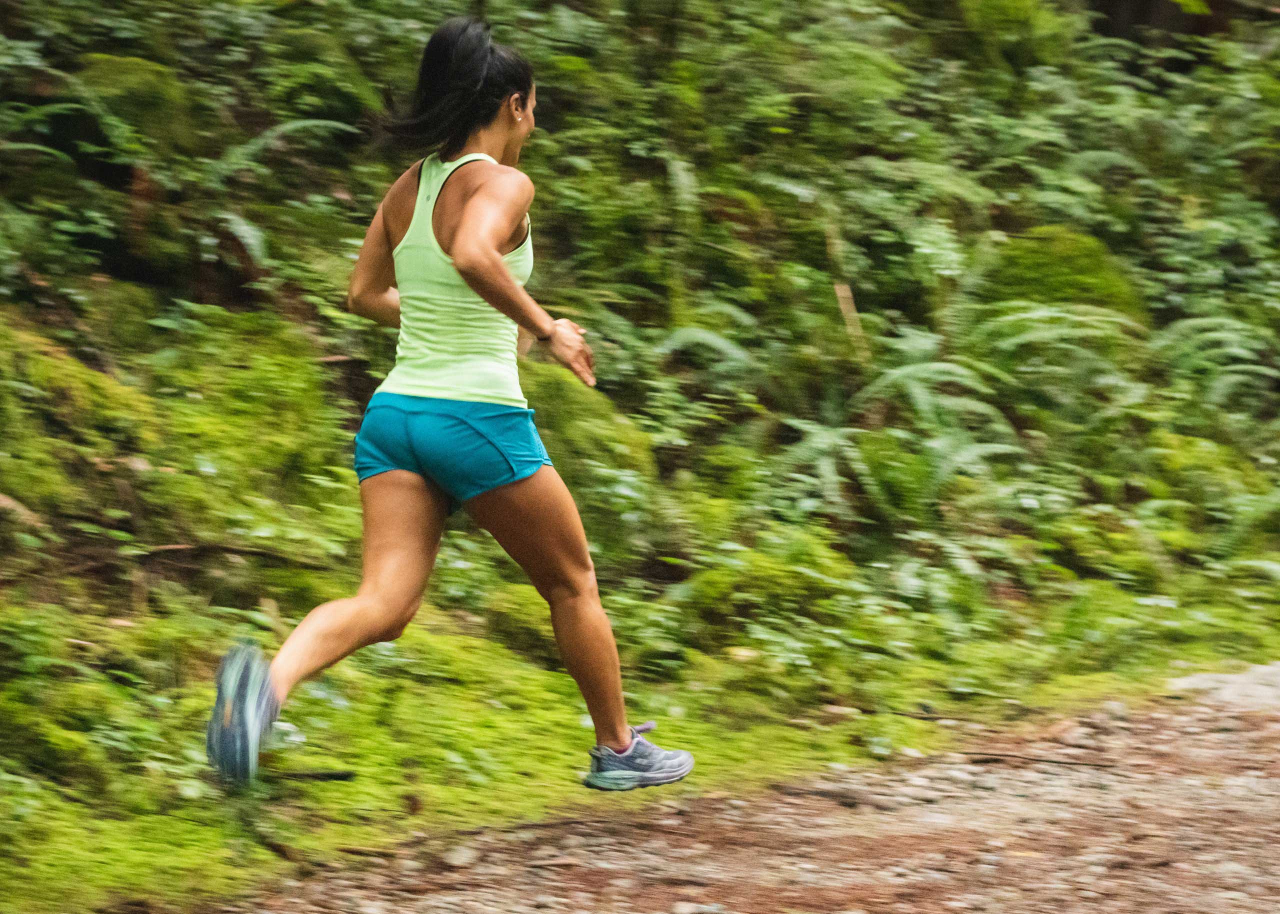 woman running on a dirth path