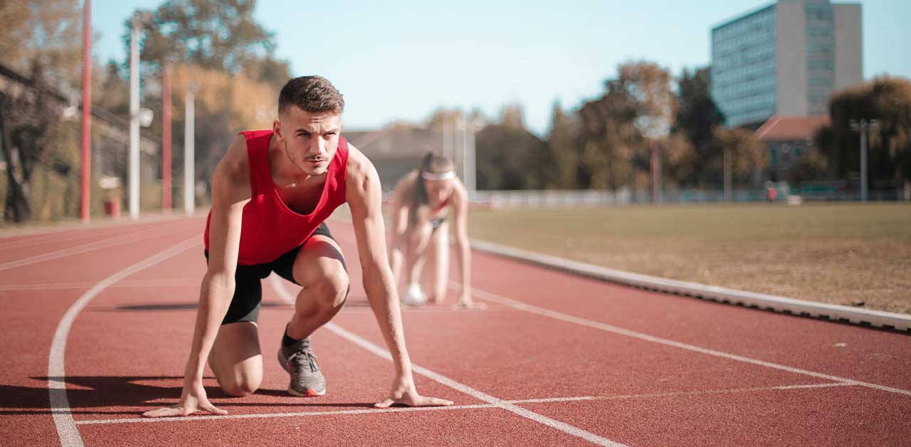 Two people running track