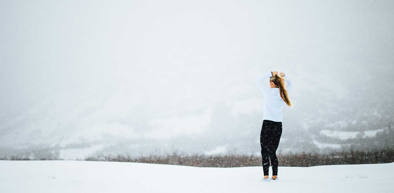 Woman running in the snow