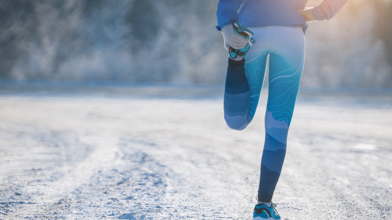 Runner stretching in the cold