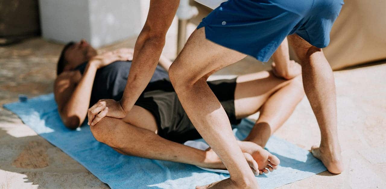 person experiencing groin pain after running