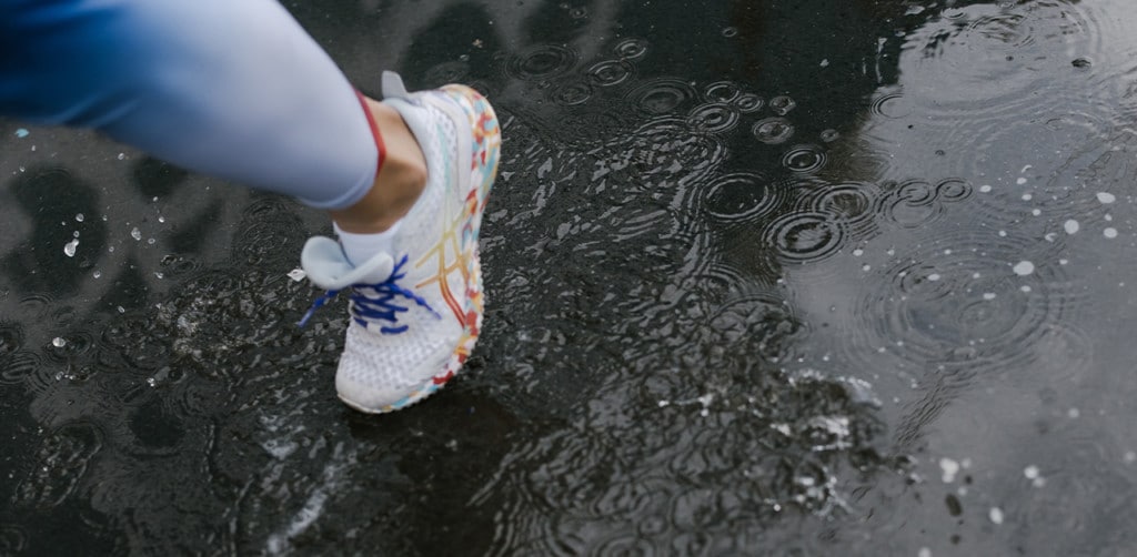 Person running in the rain